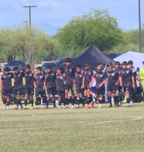 Youth soccer team huddle