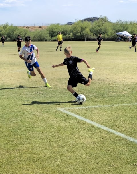Soccer player dribbling